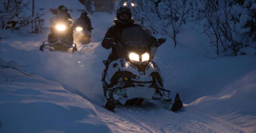 From Tromsø: Evening Snowmobiling Tour at Camp Tamok - Gear Up for Arctic Night: thermal suit, helmet, and first-time snowmobile training
