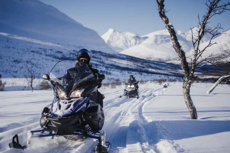From Tromsø: Snowmobiling at Camp Tamok & Snow Park Visit - Getting suited up: thermal gear, helmet, and the scarf you’ll be glad you brought